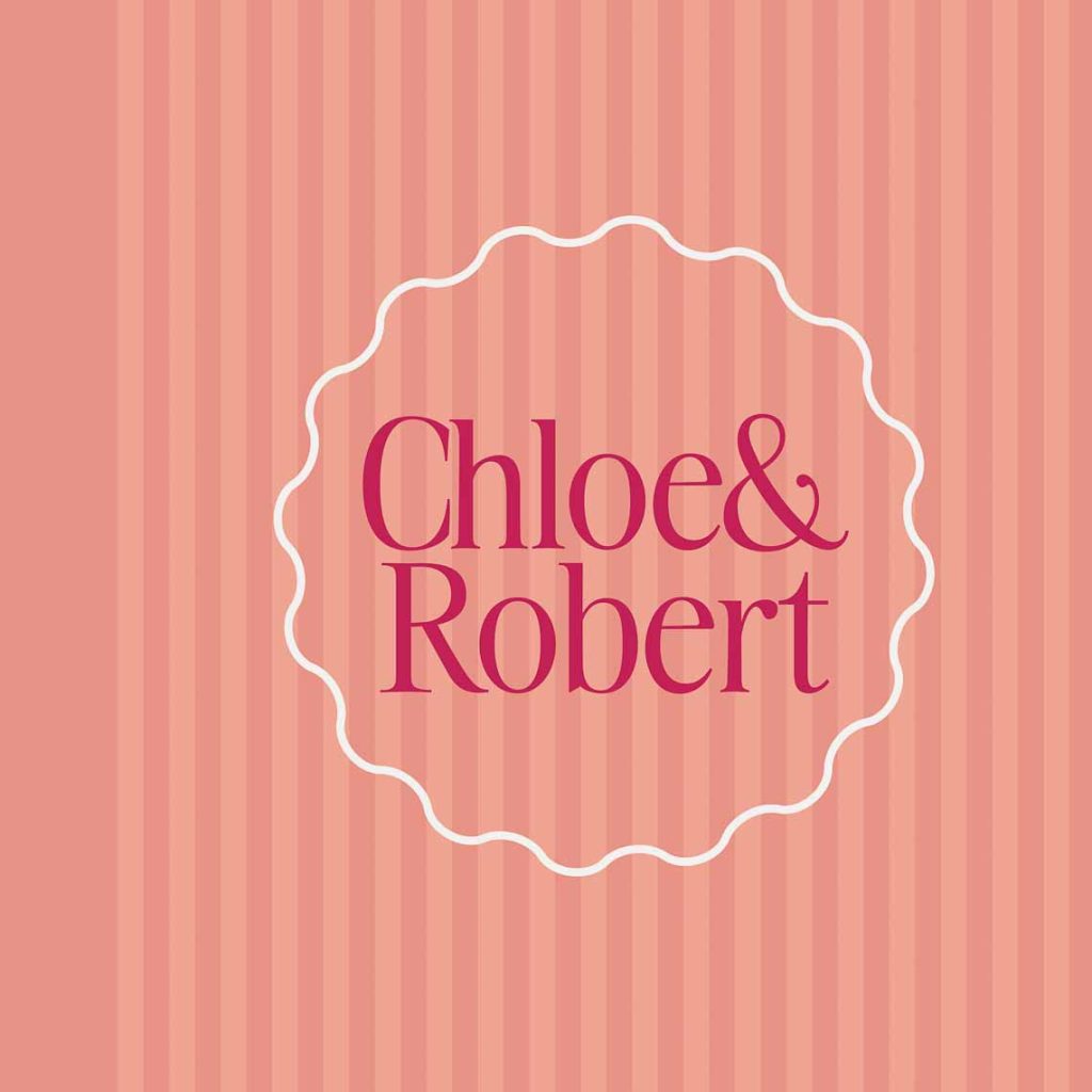 Luxe Wedding Photo Album with fun creative cover design in peachy and desert toned stripes, pink lettering and white wavy border to frame your names