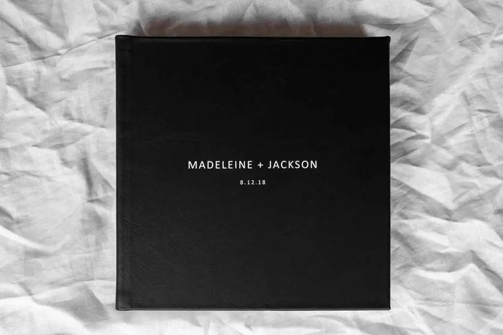 Square Photo Albums. Black leather photo album cover with white embossing perfect for a black & white wedding colour palette.