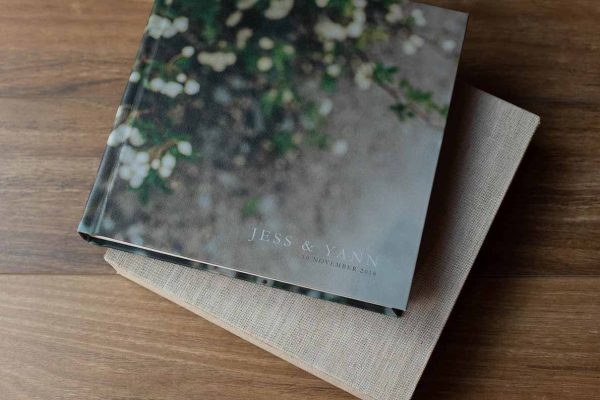 Wedding album with photo cover and custom lettering overprinted on the image