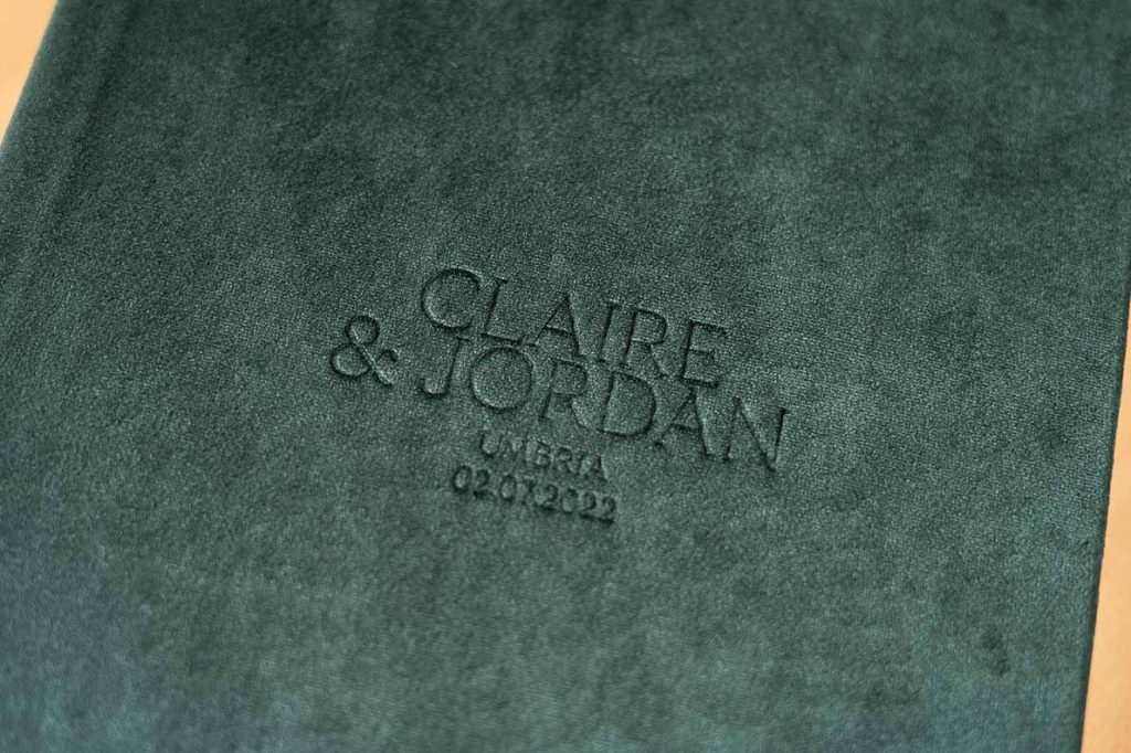 Velvet photo album for wedding photos featuring a dark green cover but an assortment of jewel colours is available
