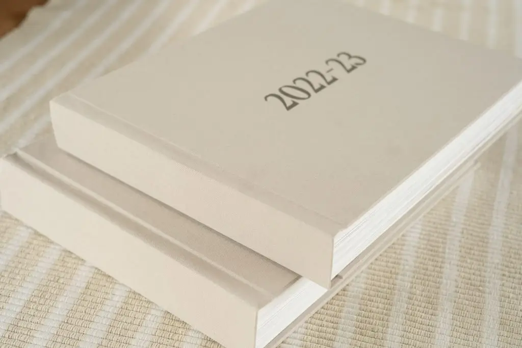 Yearly Family Photo Books. Custom Family Photo Albums - two-volume set. Personalised Covers. Choose from a variety of colours and designs.