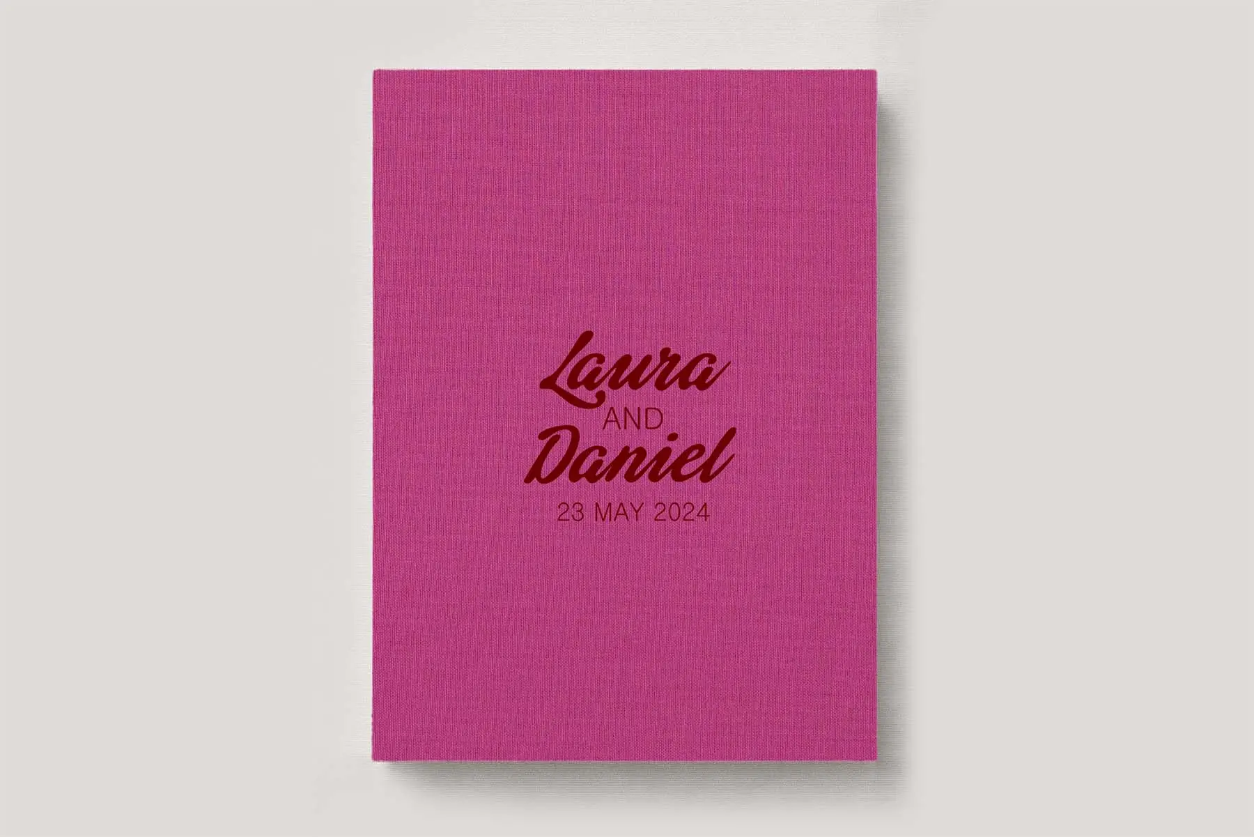 Premium Wedding Photo Album with luxe linen cover in colour Fuchsia pink. Available in 3 formats; Landscape (horizontal), Square & Portrait (vertical) in 3 sizes; small, medium and large photo albums.