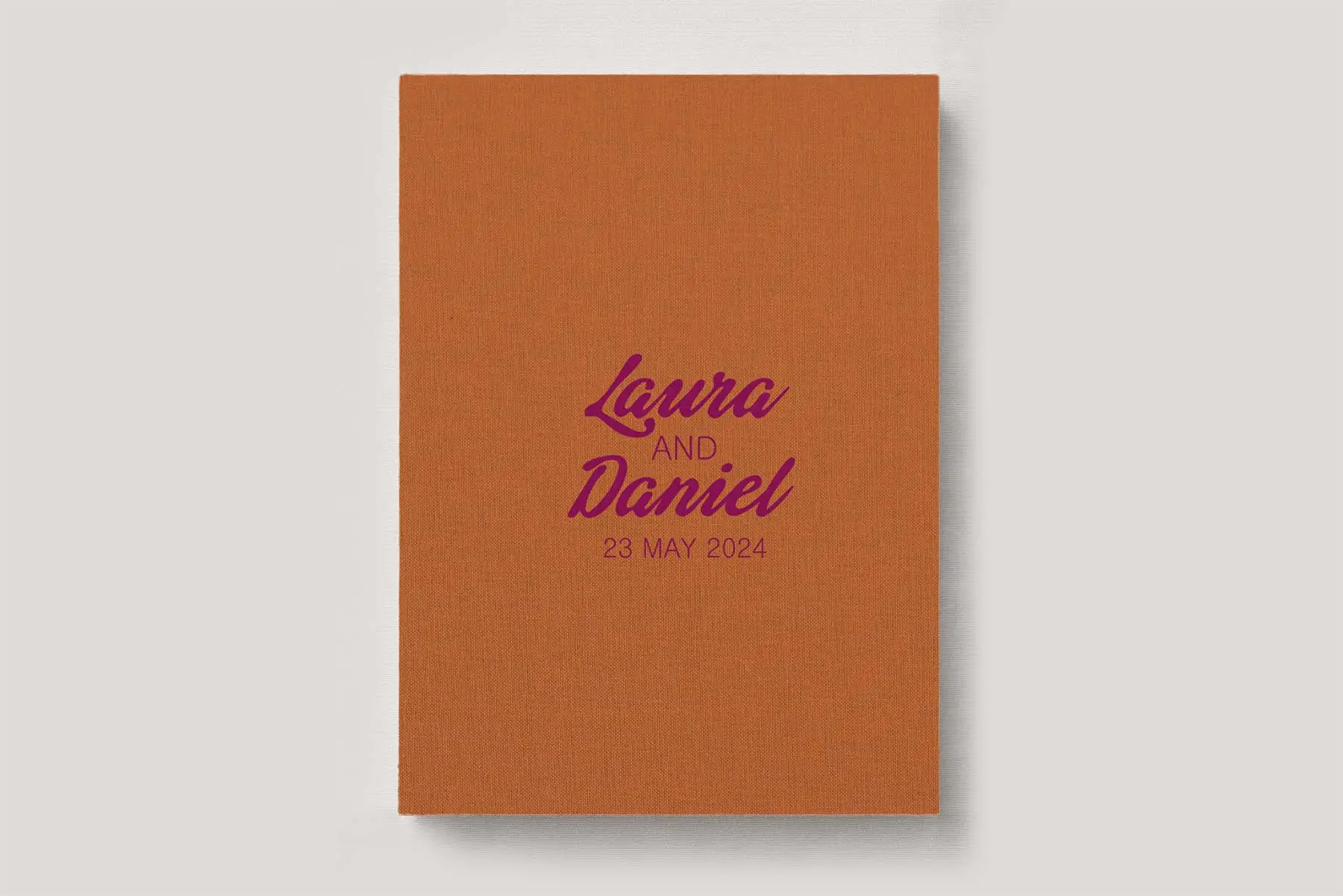 Premium Wedding Photo Album with luxe linen cover in colour Marmalade orange. Available in 3 formats; Landscape (horizontal), Square & Portrait (vertical) in 3 sizes; small, medium and large photo albums.