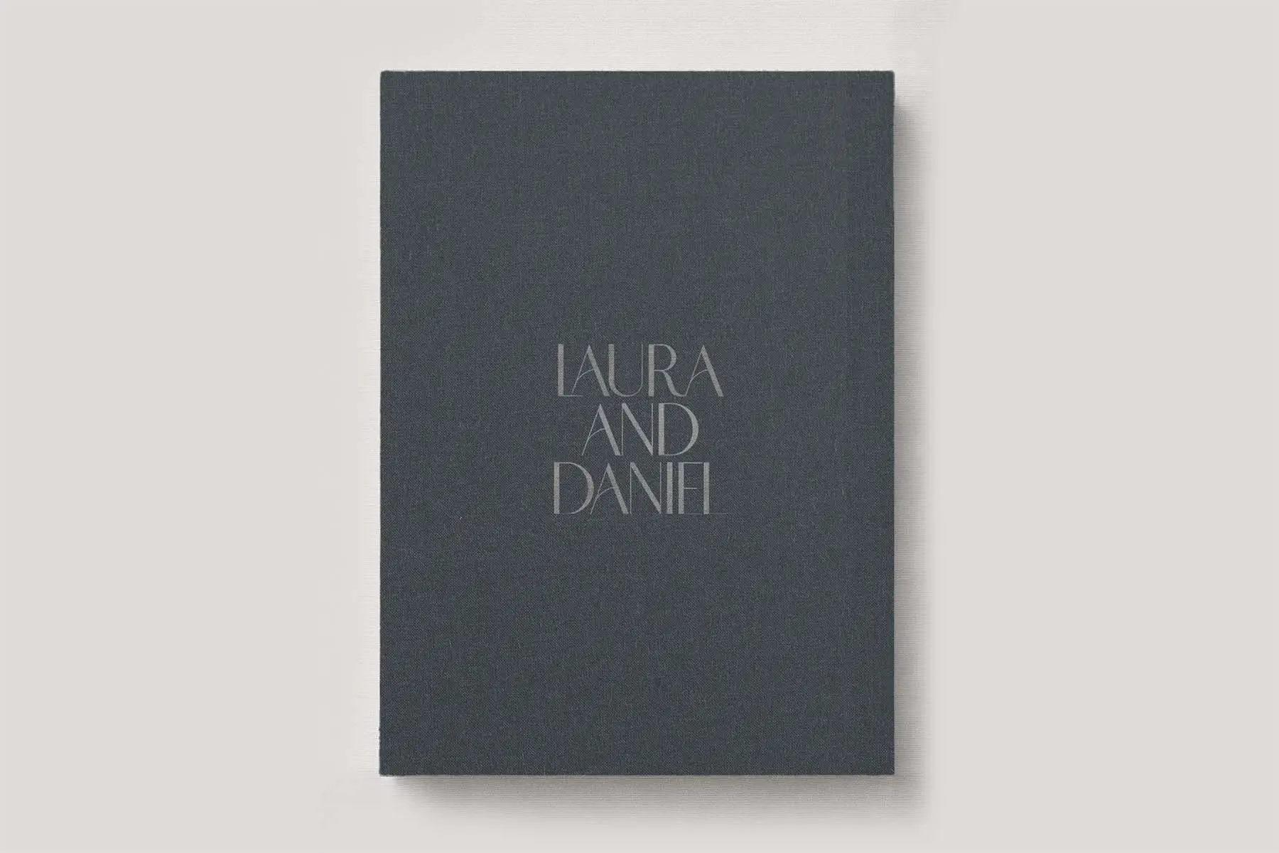 Premium Wedding Photo Album with luxe linen cover in colour Seal Grey. Available in 3 formats; Landscape (horizontal), Square & Portrait (vertical) in 3 sizes; small, medium and large photo albums.