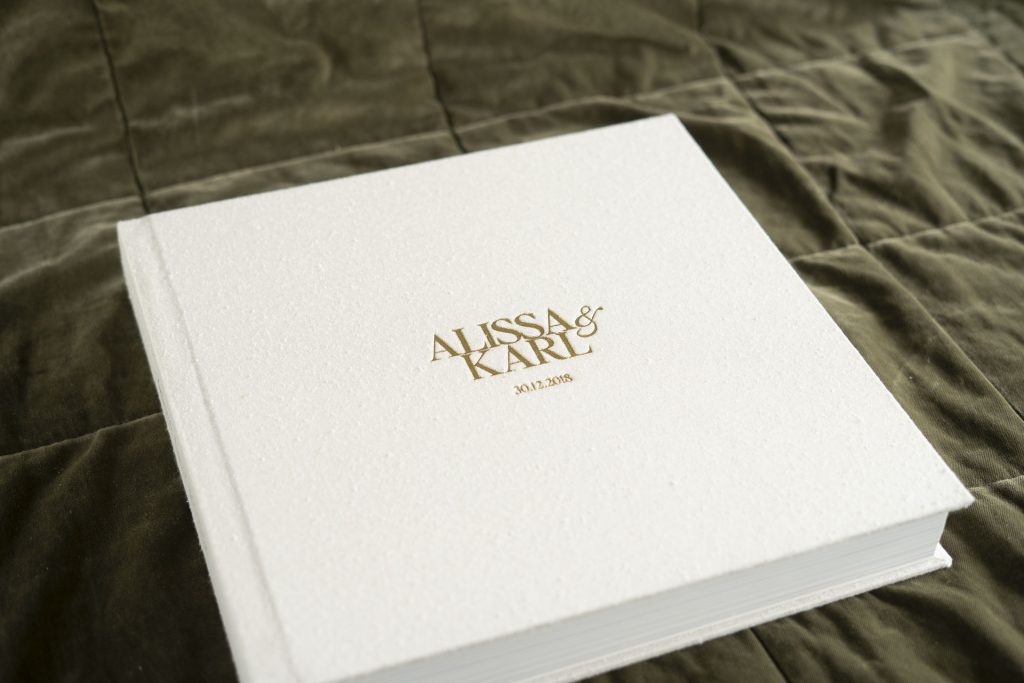 Wedding Photo Books & Albums Wedding Album with textured silk fabric cover in a natural colour (Silk Pearl) and Gold Foil embossing to personalise the cover with the couples names & wedding date on the front and Best Day Ever on the spine.