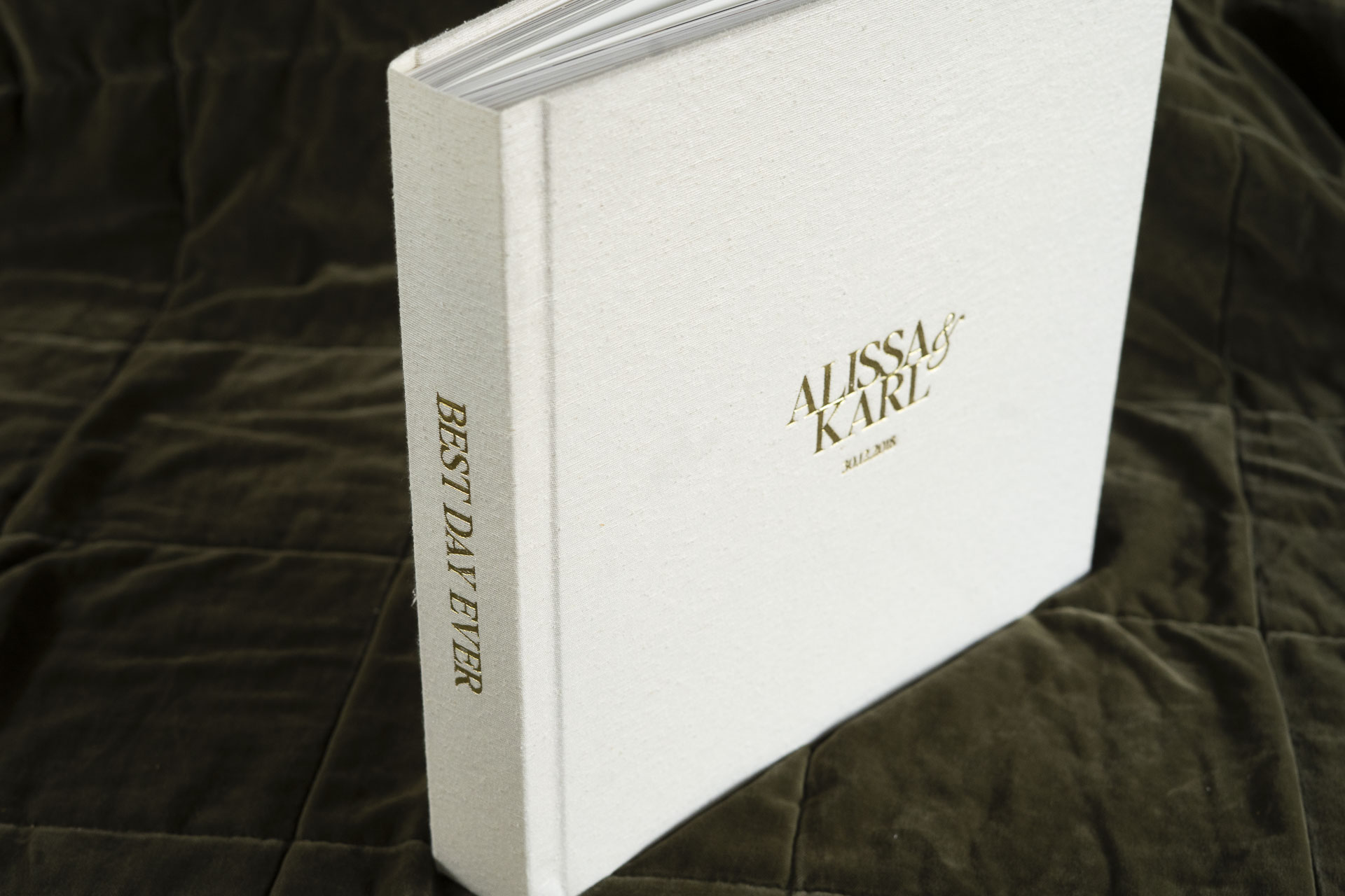 Wedding Album with textured silk fabric cover in a natural colour (Silk Pearl) and Gold Foil embossing to personalise the cover with the couples names & wedding date on the front and Best Day Ever on the spine.