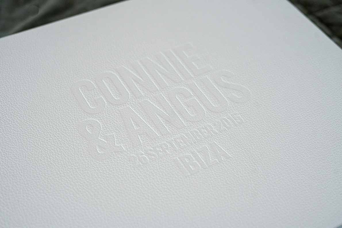 Wedding album cover with large blind embossing on front cover in a classic white leather.