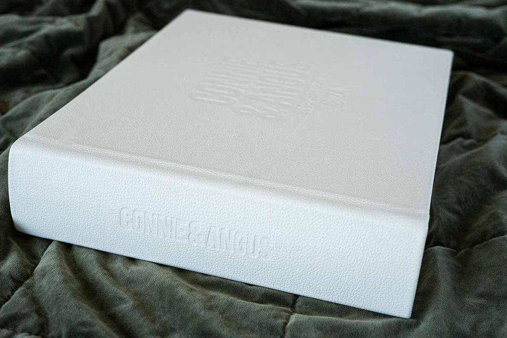 Wedding album cover with large blind embossing on front cover and spine embossing in a classic white leather.