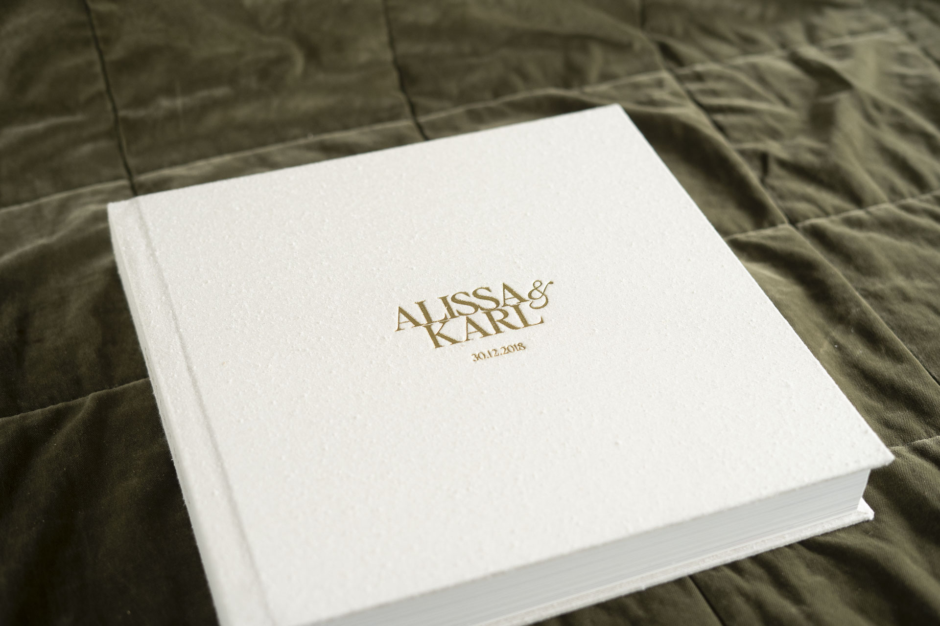 Professionally Printed Albums. Wedding Album with Silk Fabric cover in the natural tone Pearl with Gold Lettering in a square 12x12 inch album