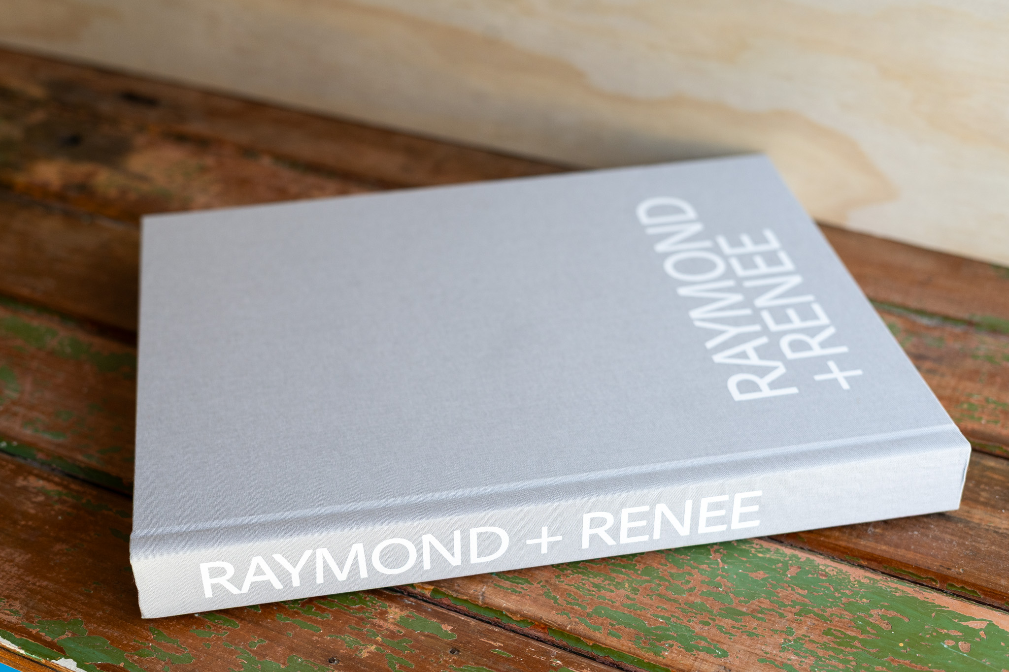 Editorial Wedding Albums for Candid, Fashion-Led Photography. Wedding Album Fashion Collection — Light Grey Linen Cover with White Lettering in Bold Typography