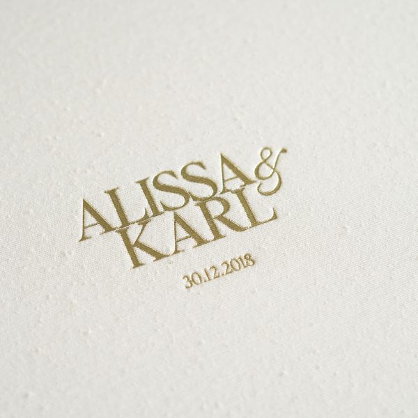 Wedding Album with textured silk fabric cover in a natural colour (Silk Pearl) and Gold Foil embossing to personalise the cover with the couples names & wedding date.