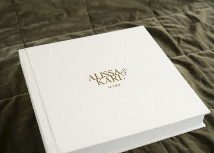 Australia's Best Photo Albums. This Wedding Album features a textured silk fabric cover in a natural colour (Silk Pearl) and Gold Foil embossing to personalise the cover with the couples names & wedding date on the front and Best Day Ever on the spine.